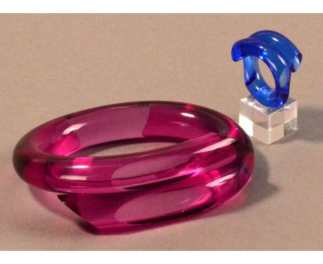 MARLENE McKIBBIN (born 1953); a pink acrylic faceted bangle, inner diameter 7cm; with a blue acrylic faceted ring, ring size 