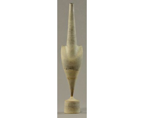 HANS COPER (1920-1981); a stoneware cycladic arrow form pinned to drum base, incised lines to neck, white and grey slips, bro