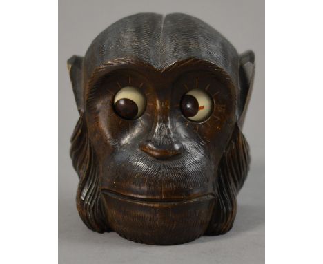 A Black Forest monkey clock, stamped 5791, height 11cm. CONDITION REPORT: There is a small patch if paint loss to monkey's le