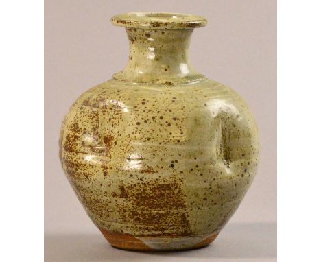 JIM MALONE (born 1946); a 'bashed' stoneware bottle, green ash glaze, impressed JM mark, height 22.5cm.

Provenance: Purchase