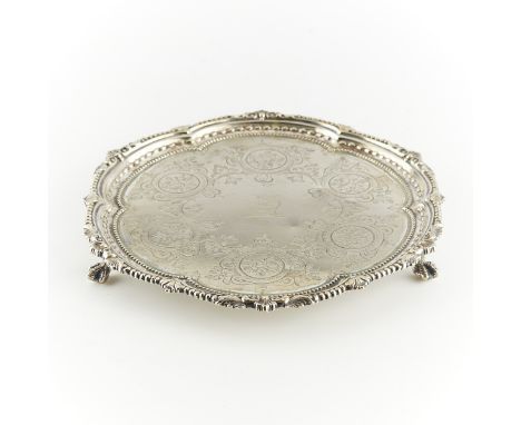 Martin, Hall &amp; Co., Sheffield, United Kingdom. Silverplate serving tray. With three ball and claw feet. The top etched wi