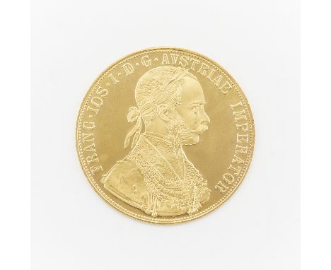 1915 Austrian gold four ducat coin. The obverse with a laureate, armored bust facing right; the reverse with a crowned imperi