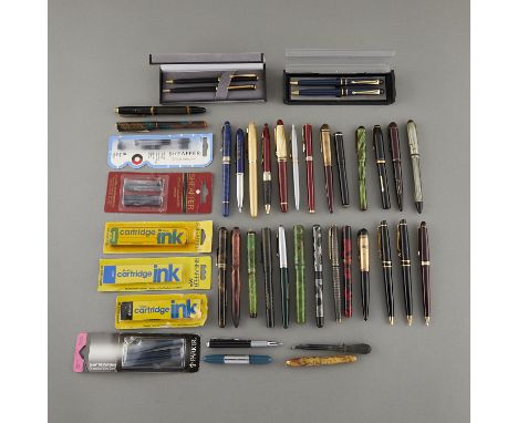 Group of 36 ballpoint pens, mechanical pencils, and fountain pens. 14 fountain pens with 14k gold plated nibs. 15 ballpoint p