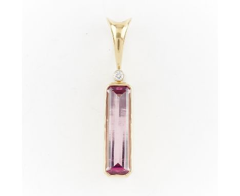 14k yellow gold pendant set with large pink step cut tourmaline in a gold bezel surmounted by a brilliant cut diamond (approx