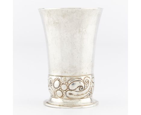 English 800 silver beaker. The exterior with a band of stylized floral and foliate motifs. Marked 800 along the rim; marked "