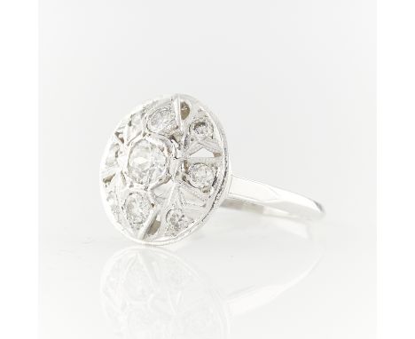 14k white gold Art Deco style nine stone diamond ring in the form of a filigree circle, with three larger diamonds down the c