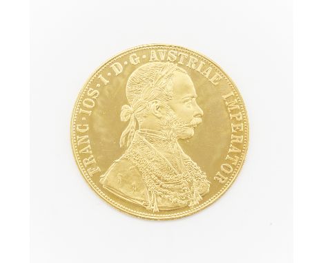 1915 Austrian gold four ducat coin. The obverse with a laureate, armored bust facing right; the reverse with a crowned imperi