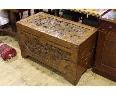 Oriental carved camphorwood trunk bearing Hong Kong label, 60cm by 102cm
