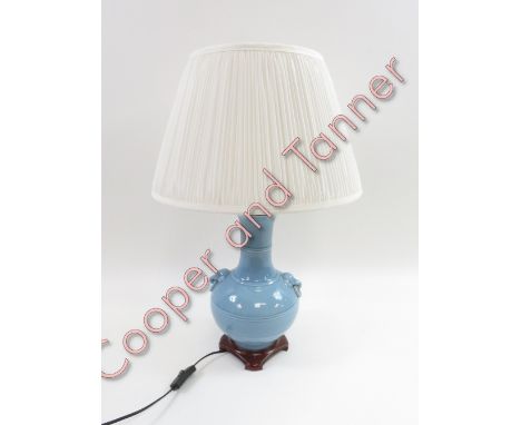 A Chinese blue glazed vase, converted to a lamp standing on a wooden base, 37cm high