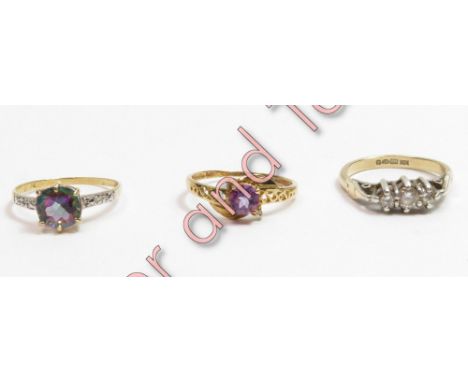 A single stone amethyst ring; a magic topaz ring with a single cut diamond to each shoulder; both stamped '9K', 2.2 g gross; 