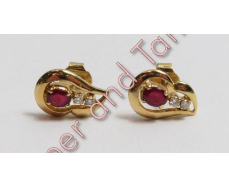 A pair of ruby and diamond earstuds, unmarked, the oval cut with a pair of small brilliant cuts below, 3.6 g gross