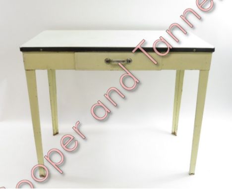 A vintage side table with white a white enamel top and a single drawer, 74cm high, 89cm long, 43cm deep