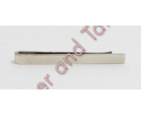 A Georg Jensen silver tie slide, of plain form, model 84A, with import marks for 1973, 5.8cm long