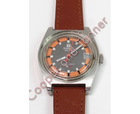 A Tissot Swiss PR516 diver's wrist watch with a leather strap and an orange dial