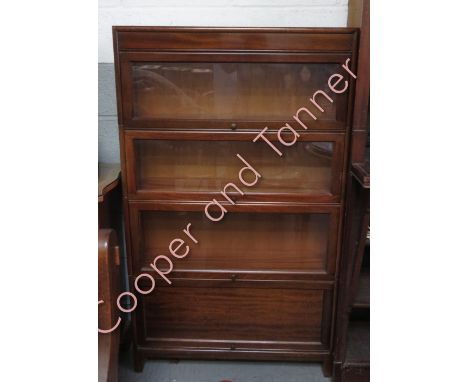 A four section Globe Wernicke style bookcase, 146cm high, 86cm long, 25cm deep