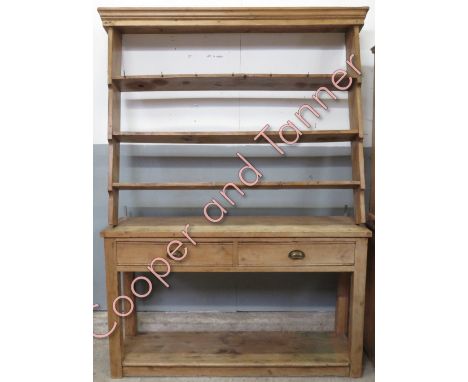 A Victorian pine dresser and plate rack, set with single drawers and three open shelf sections, 222cm high, 156cm long, 43cm 