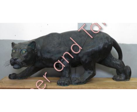 A large life-size fibreglass model of a panther, 137cm long, 50cm high