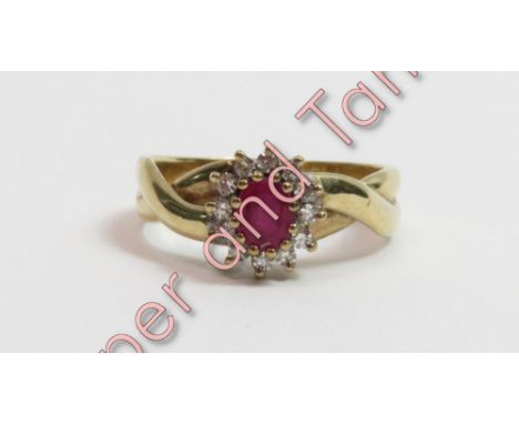 A 9 carat gold ruby and diamond cluster ring, the oval cut enclosed by single cut diamonds, finger size P, 3.8 g gross