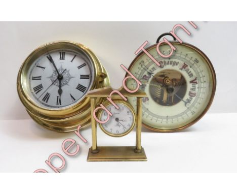 A brass cased bulkhead clock, along with a wall barometer and a Swiza desk clock
