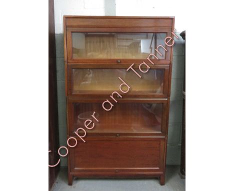 A 20th century mahogany Globe Wernicke style booked, set with four sections, 146cm high, 87cm long, 24cm deep