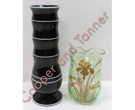 An enamelled Art Nouveau light green glass vase, together with a black and white glass vase in the style of Michael Powolny