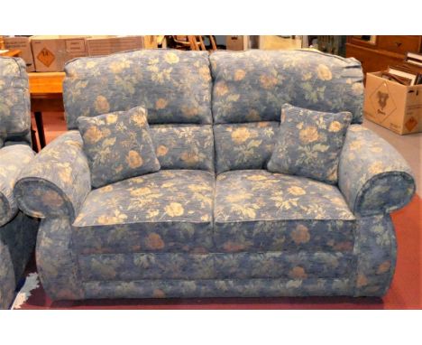 A four piece lounge suite comprising of two 2 seater sofas, and two manual reclining arm chairs, upholstered in blue floral f