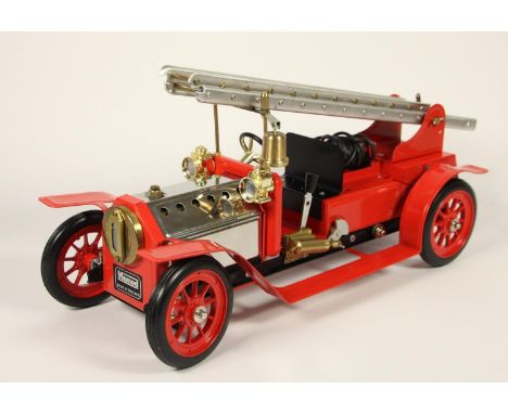 A Mamod live steam 1404 Fire Engine FE1, depicting an Edwardian machine, 490 x 185 x 250mm, original box and paperwork, fired