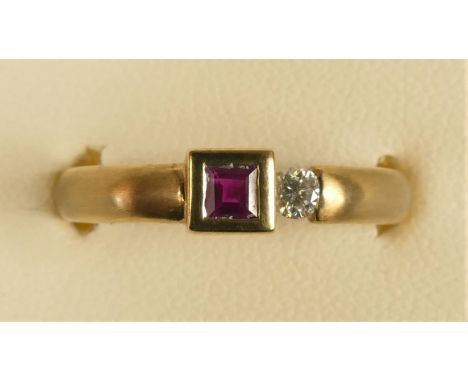 A 9ct gold ruby and brilliant cut diamond ring, stated weight 0.08cts, M 1/2, 3.9gm 