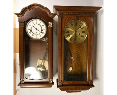 A Hermel wooden wall clock together with another similar and oak cased mantel clocks. (2) 