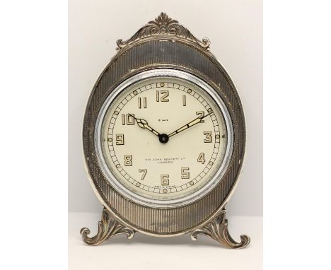 A silver mounted desk easel time piece, retailed by Sir John Bennett Ltd, London, London import 1920, the 8 day movement by S