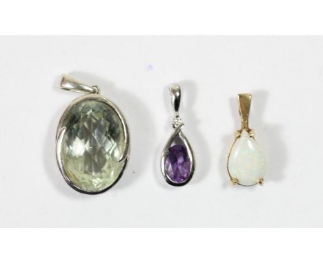 A 9ct white gold amethyst and diamond pendant, an opal pendant and another pendant 