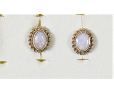 A pair of 9ct gold and opal earstuds, 7 x 5mm, 1.3gm 