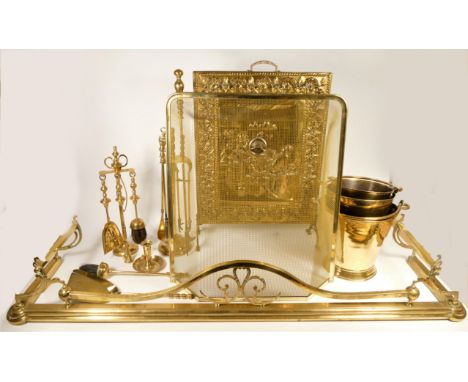 A brass fire surround, together with a pressed brass fire screen, depicting an 'inn' scene, together with fire buckets and to