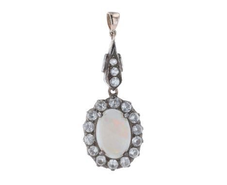 Opal And White Saphire Pendant, tests low carat gold and silver. Measures 3.5cm by 1.4cm. Weighs approximately 3g