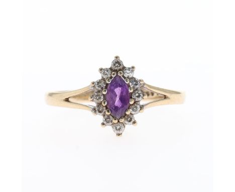 Amethyst And CZ Gold Halo Dress Ring, Tested 375. Ring size UK O Weighs approximately 1.3g