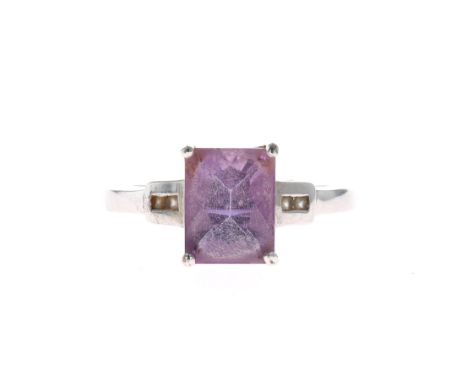 Amethyst and White Gemstone Gold Dress Ring, stamped 375. Ring size UK N 1/2. Minor misshaping to the band. Weighs approximat