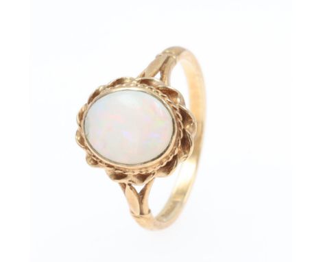 Opal Gold Cabochon cocktail Ring, stamped 375. Ring size UK Q.5. Small chip to stone. Weighs approximately 3.2g