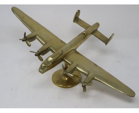 A large cast brass model of a WWII Lancaster bomber, wingspan L: 36 cm. UK P&amp;P Group 2 (£20+VAT for the first lot and £4+