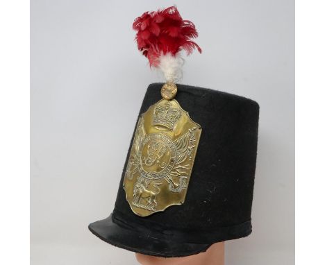 British reproduction stovepipe shako based on the Napoleonic period and the War of 1812 originals, mounted with a pressed bra