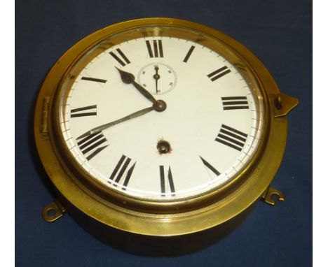 Brass cased bulk head style wall clock with enamel dial and secondary dial