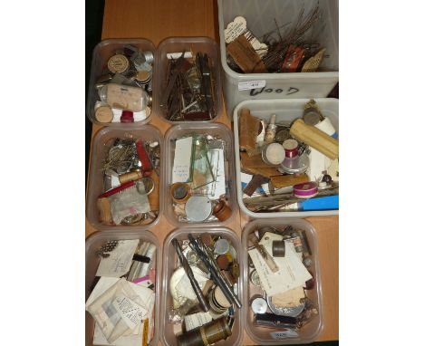Contents of a watch and clock makers tool chest including various instruments, hand tools, parts, watch screws, pins, faces, 