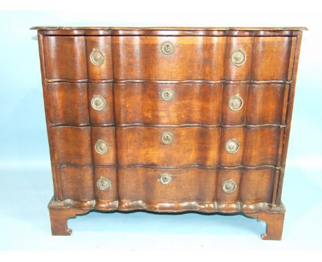 An 18th century continental oak chest of four serpentine drawers on later bracket feet, 91cm wide, 53cm deep, 79cm high.