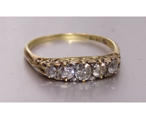 A Victorian five-stone diamond ring set old brilliant-cut diamonds with diamond points between, in 18ct gold mount, size P, 2