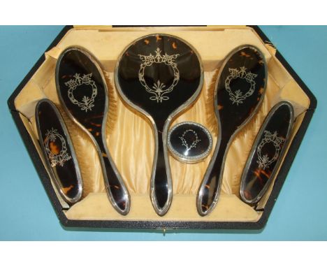 A silver and tortoiseshell five-piece dressing table set with piqué backs, in fitted case, S W Goode &amp; Co, Birmingham 192