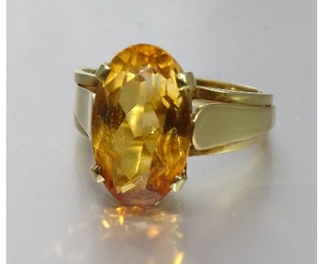 A citrine-set gold dress ring bearing Egyptian marks for 18ct gold, size N½, 5.2g. 