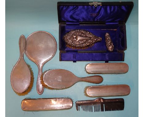 A silver-backed hair brush and matching hand mirror, with engine-turned decoration, Birmingham 1926, a matched set of four si