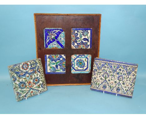 Four Islamic tile fragments in an oak frame and two similar tile sections, 19th century and earlier, frame 30 x 36cm, (3).