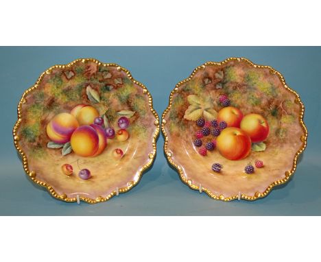 A pair of Royal Worcester cabinet plates, both painted by H Ayrton, with gilt gadroon-shaped rims, one decorated with apples 