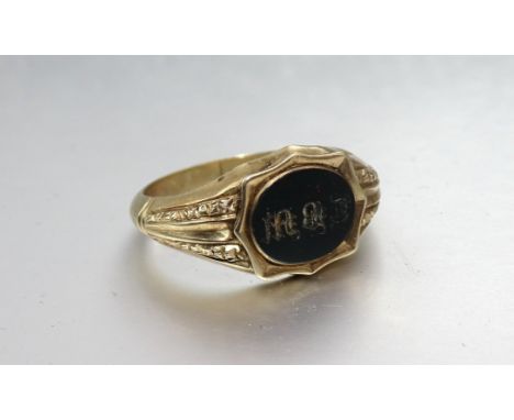 A Victorian gold signet ring set bloodstone seal "T.B.M.", size T, 2.5g. 