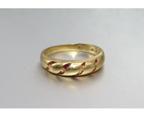 An 18ct gold ring, originally with enamelled striations, size L, 3.2g. 